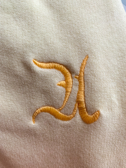 Jogging Néphélée jaune avec logo Aphaïa